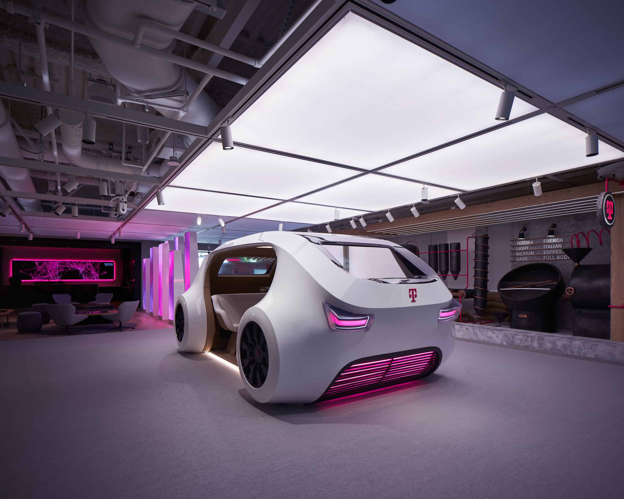 Futuristic white car with pink accents in a sleek showroom, open doors reveal its interior; ambient lights and tech displays surround.